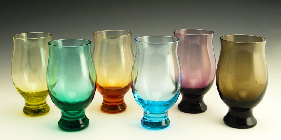 6 Zeisel Bryce Bros Silhouette Glasses: Eva Zeisel, a group of six 11 oz. Goblets, one each in Amber, Amethyst, Chartreuse, Cerulean, Green, and Smoke, Silhouette, Bryce Brothers Company, Mount Pleasant, Pennsylvania, 1952. Mouth-blown glas