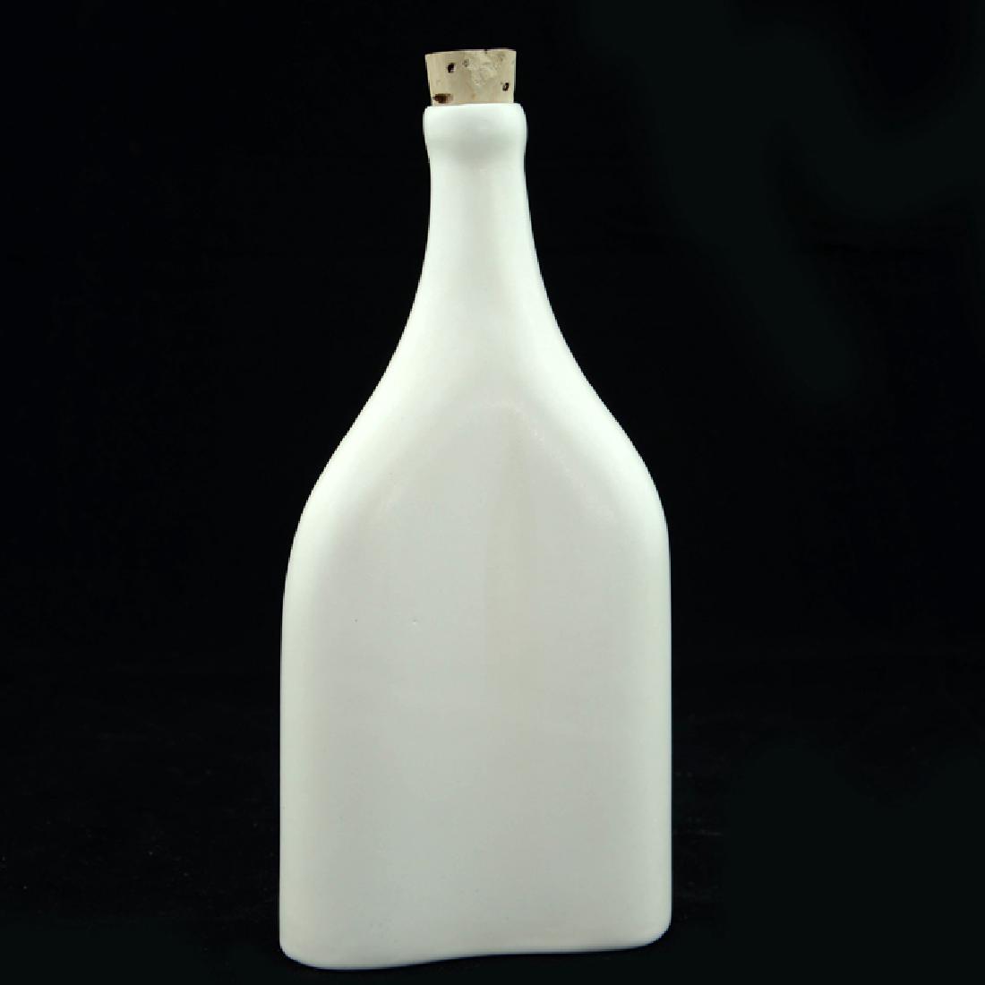 Zeisel OC Bottle with Stopper (1997): Eva Zeisel, a Bottle with Cork Stopper in a semi-matte glaze, the shape based on an earlier designer for Zsolnay Porcelain Manufactory, stamped EZ on underside, World of Ceramics, Morganton, North Car