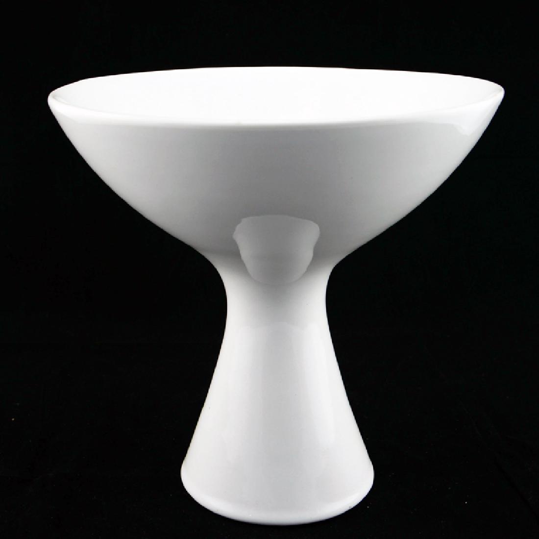 Zeisel OC Tazza Fruit Bowl (1997): Eva Zeisel, a Tazza-form Fruit Bowl with white glaze, the shape based on a 1958 design for Manifattura Mancioli, with obscured black mark, World of Ceramics, Morganton, North Carolina, for Orange Chic