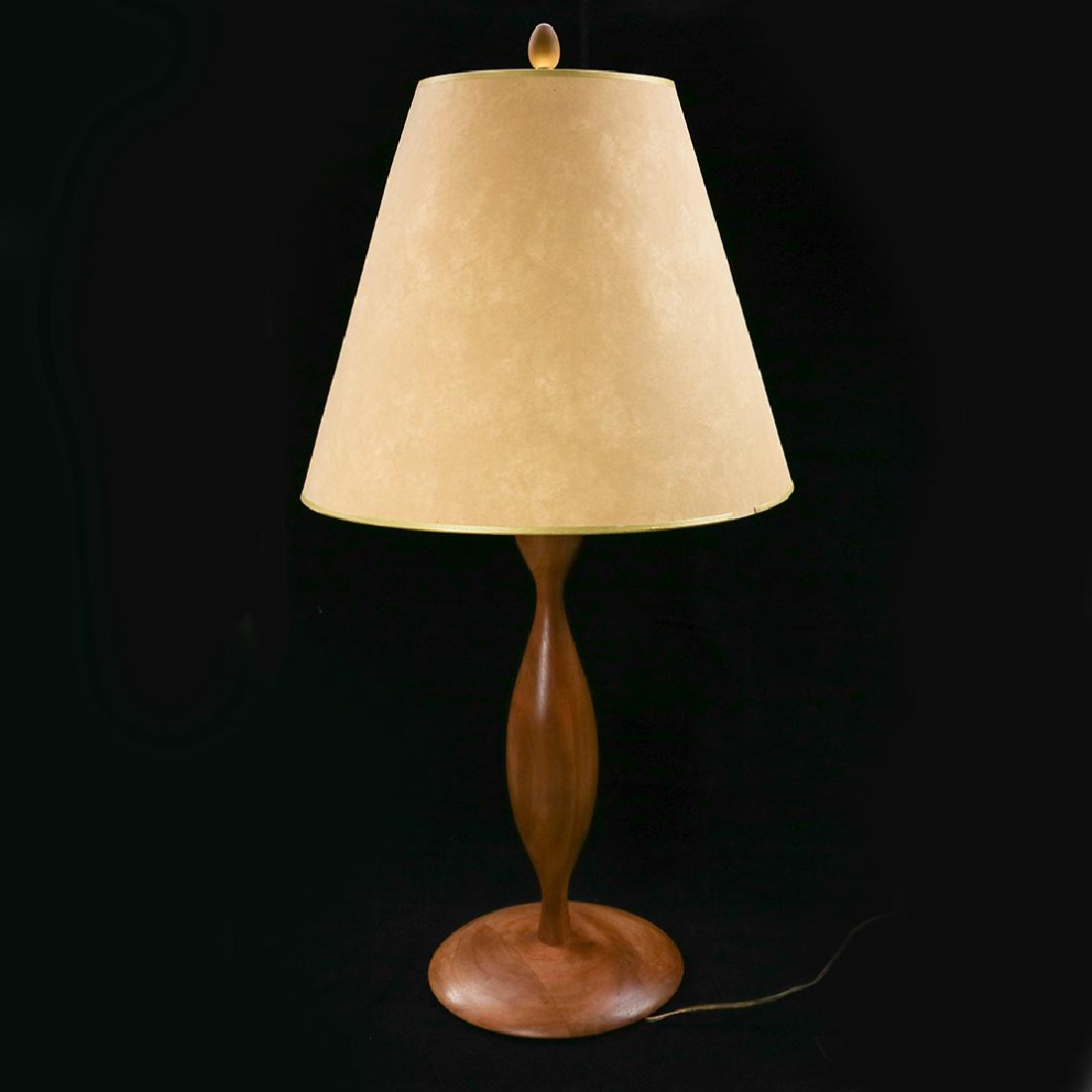 Zeisel Orange Chicken Turned Wood Lamp: Eva Zeisel, a rare turned wood Lamp by RB Universal Woodworks for Orange Chicken, comprising turned wood lampstand and constructed base, with amber glass finial, brass fittings, and coated paper shade