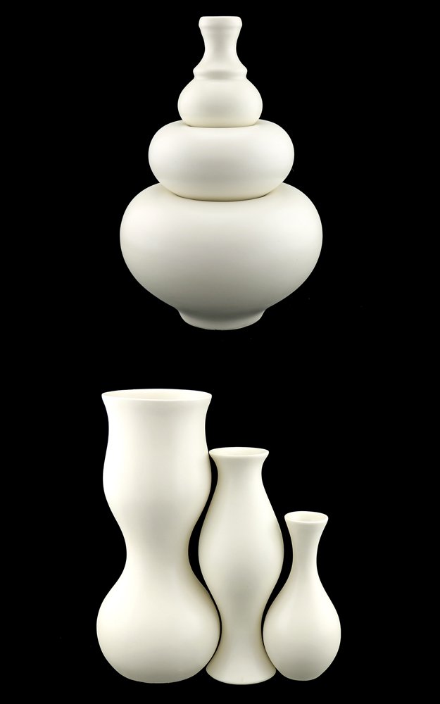 Zeisel KleinReid Pillow Stack & Upright Vases: Eva Zeisel with KleinReid, Pillow Stack Vases and three Upright Vases, KleinReid, 2002. Porcelain with satin glaze. The underside of each the pillow stack vases impressed with a facsimile signature Ev
