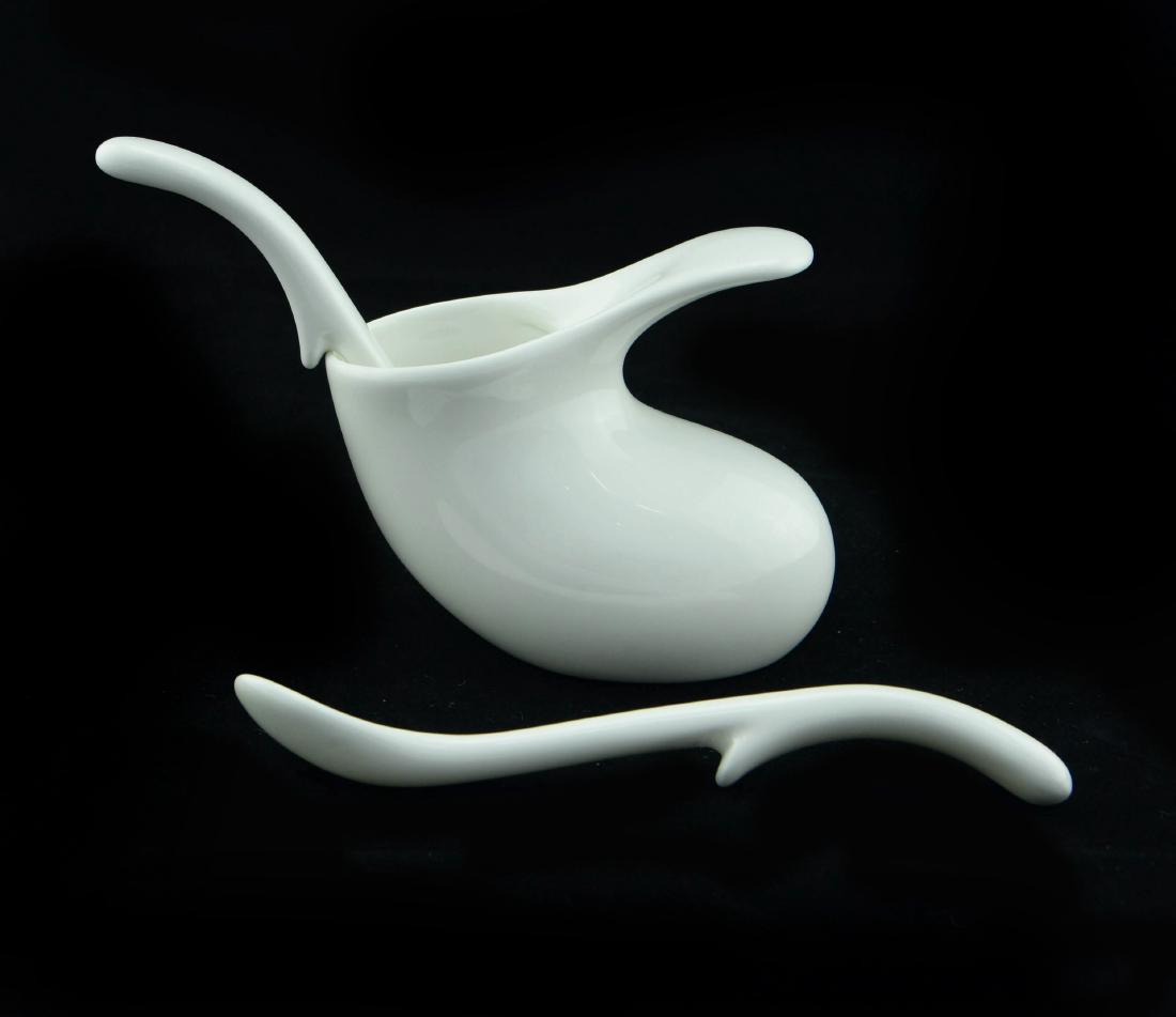 Zeisel Infant Set for Neue Galerie (2008): Eva Zeisel, an Infant Feeder and Spoon, together with a second Spoon, based on a 1946 design that was never produced, produced for the Neue Galerie, 2008. Bone porcelain. Infant Feeder 3 ½ x 2 ½ x 4