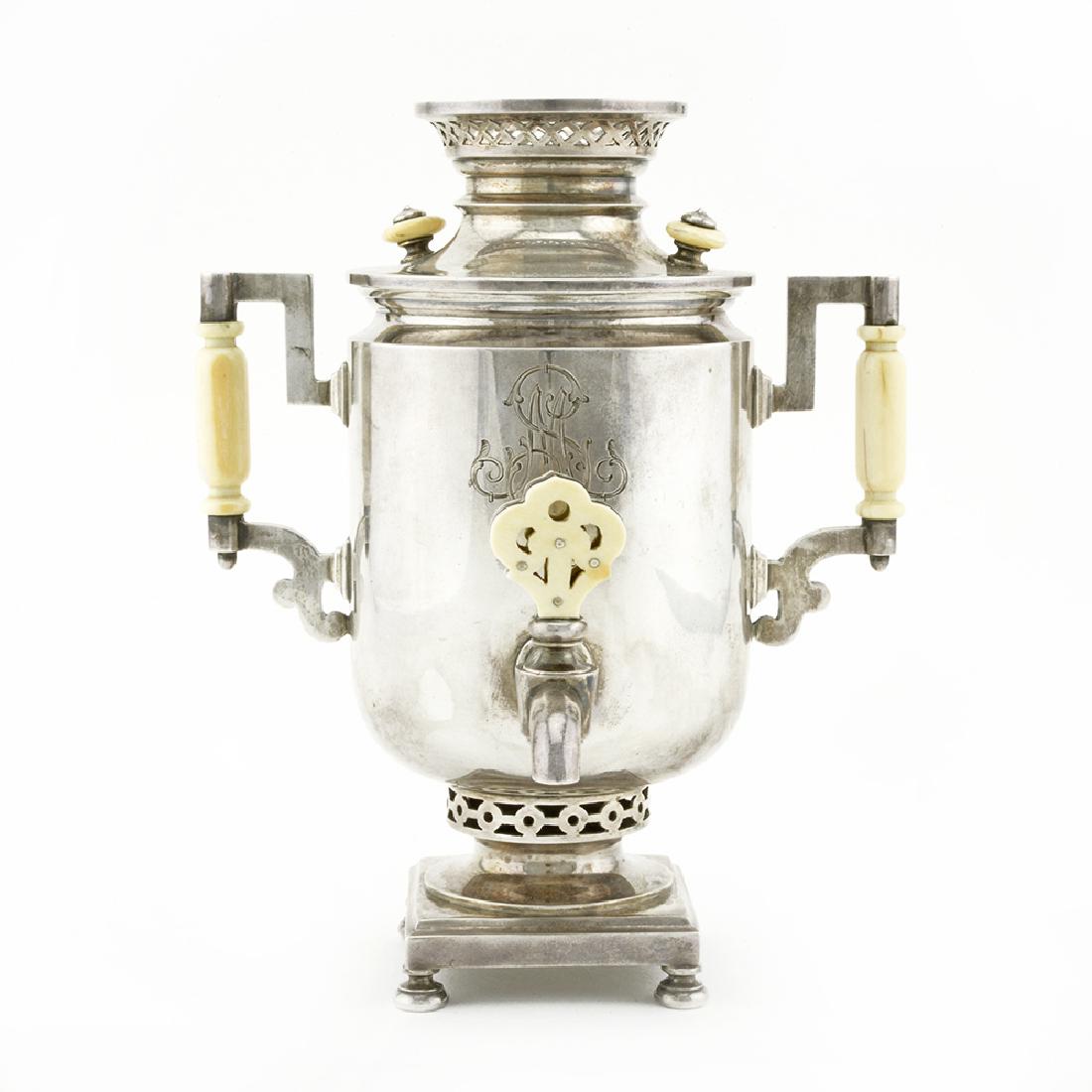 Russian antique silver miniature samovar: A Russian parcel gilt silver miniature model samovar, Grachev Brothers, St Petersburg, circa 1895. The detailed model samovar of the barrel form which enjoyed the greatest popularity at the end of the