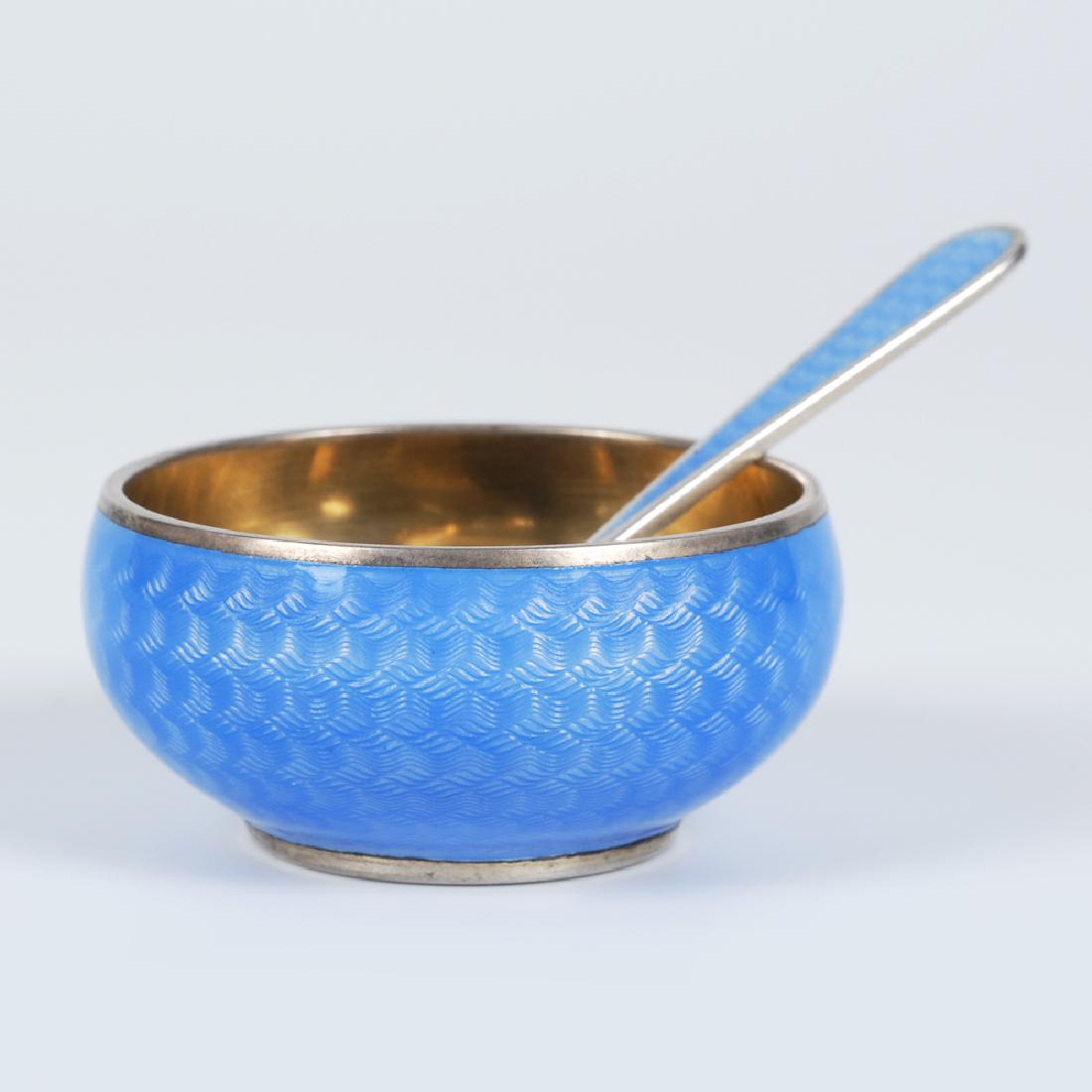 Russian Grachev silver and enamel open salt w/spoon: A Russian silver gilt and guilloche enamel open salt with matching spoon, Grachev, St. Petersburg, circa 1899-1903. Of circular form, the exterior of the body enameled in a sky blue translucent enamel