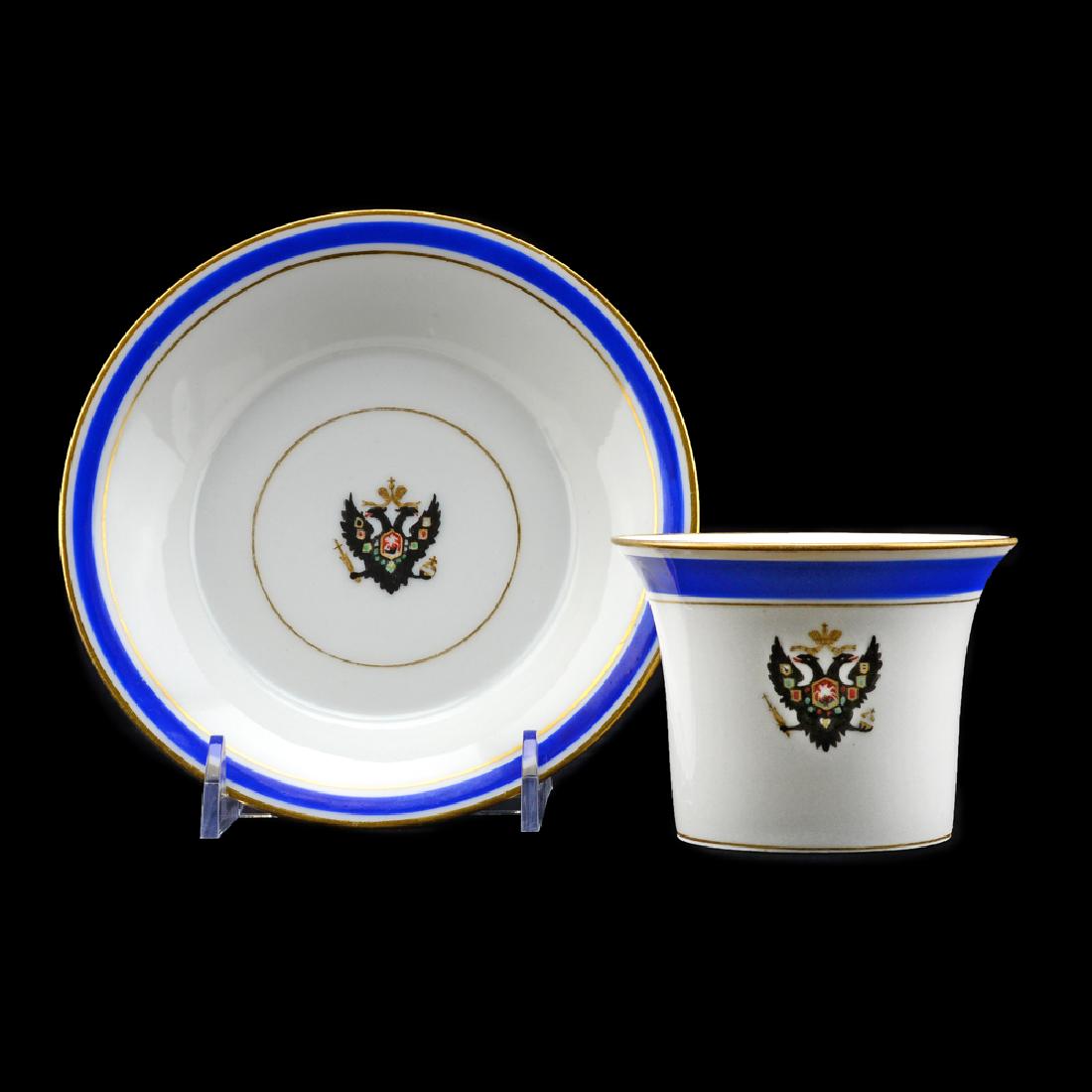 Russian IPF Tsarskoe Selo Palace Service Cup & Saucer: An antique Russian porcelain cup and saucer from the Tsarskoe Selo Palace Service. Made by the Imperial Porcelain Manufactory, St. Petersburg, from the reign of Nicholas II. Cup manufacture date of 19