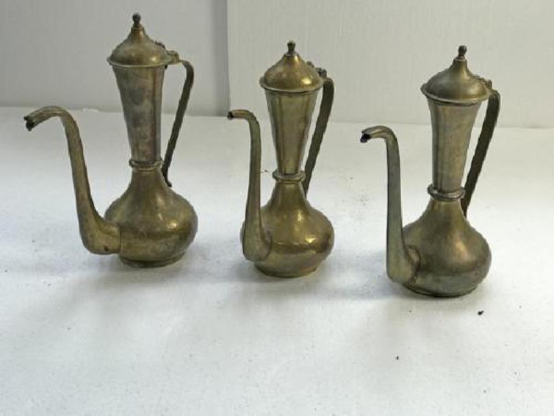 A lot of 3 Russian antique hammered brass coffee pots: A group of three antique Russian hammered brass Persian-style Coffee/Tea Pots in Arts and Crafts, circa 1900, manufactured in Tula or Moscow.