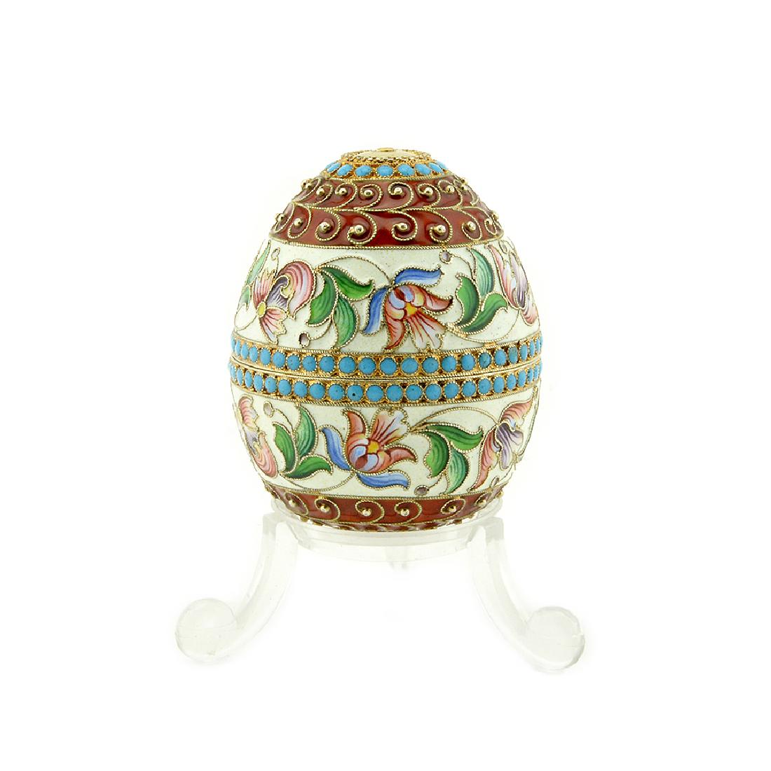 Antique Russian NIKOLAI ALEKSEEV ENAMEL EGG: A Russian silver gilt and shaded cloisonne enamel egg that separates to form a pair of egg cups, Nikolai Alekseev, Moscow, 1899-1908. The two-part egg separating to form a pair of egg cups, the exteri