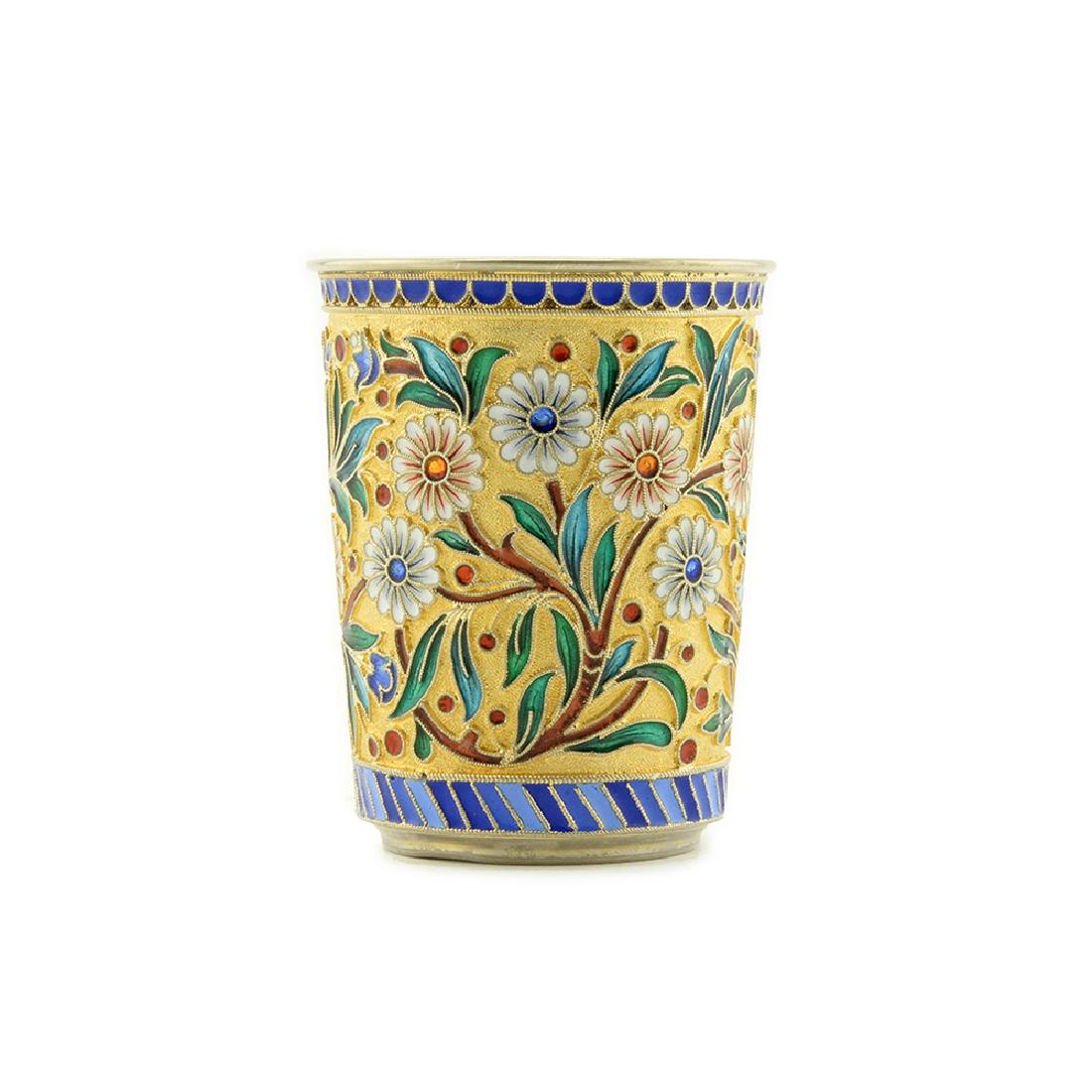 Ovchinnikov Cloisonne enamel beaker: A Russian gilded silver and shaded cloisonne enamel beaker, Ovchinnikov, Moscow, 1896. The slightly flared sides are decorated with brightly colored daisies within scrolling floral and foliate motifs 