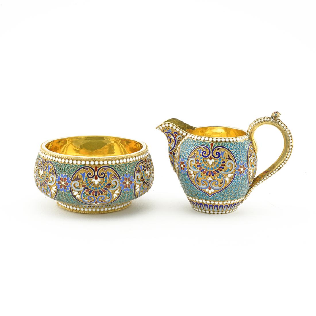 Klingert Silver Cloisonne Enamel Creamer and Sugar Bowl: A Russian gilded silver and cloisonne enamel creamer and sugar bowl set, Gustav Klingert, Moscow, 1892/1893. The exteriors of both brightly-colored anthemia and scrolling foliage against a stippled gi