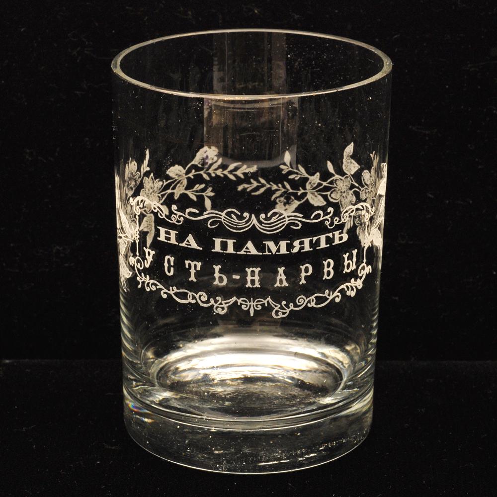 A 19th-century commemorative Russian glass beaker: A Russian glass commemorative tumbler etched with a scroll and floral motif design, with a rectangular cartouche inscribed in Russian In Memory of Ust-Narva, a spa town popular with the Saint Petersbu