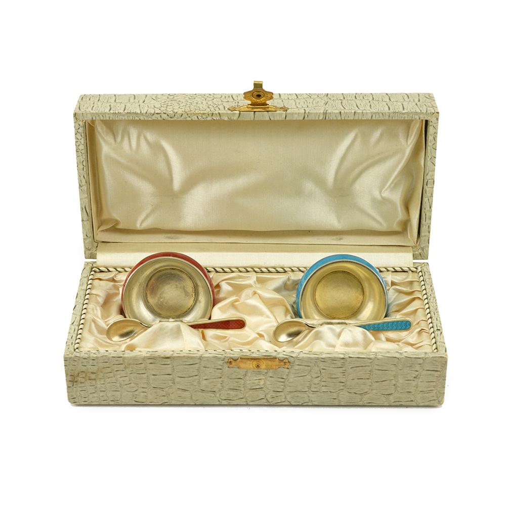 Pr of Russian silver & enamel salts and spoons: A pair of beautiful Russian silver gilt and guilloche blue and red enamel salts and spoons, Grachev Brothers, St. Petersburg, circa 1896-1908 in fitted box. 2" diam (4.9cm)