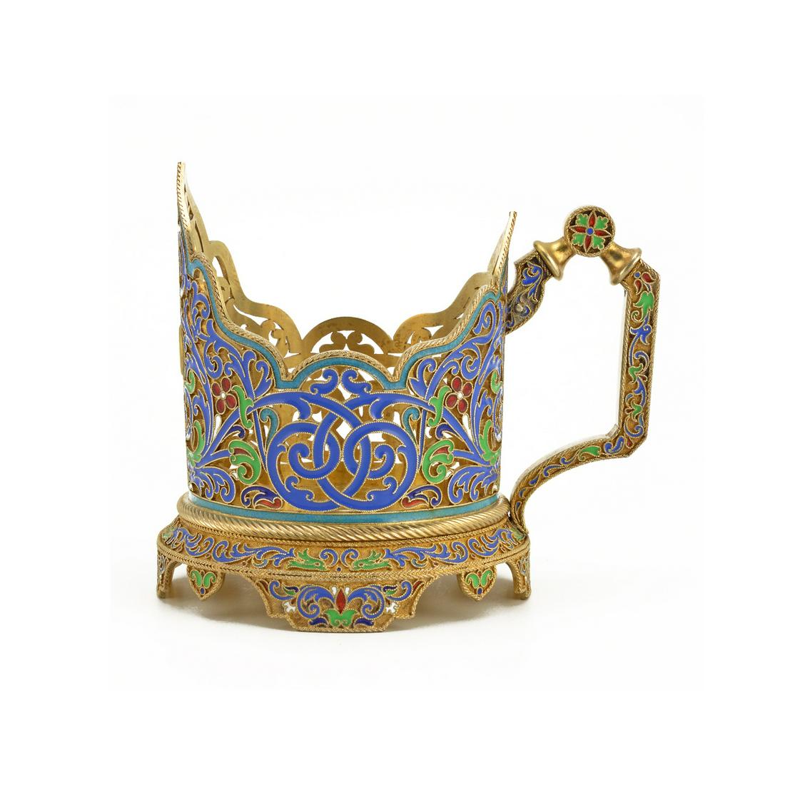 Grachev silver-gilt & cloisonné enamel tea glass holder: A silver-gilt and cloisonné enamel tea glass holder, Grachev, St Petersburg, circa 1890of cylindrical shape, the pierced body with arched prow and scalloped rim, centring a silver-gilt cartouche,