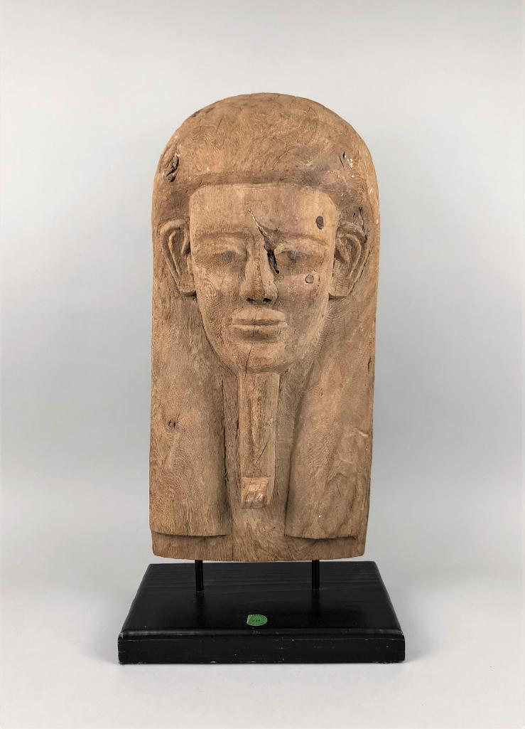 Large Egyptian Wood Mummy Mask, ex Sotheby: Egypt, Late Period, c. 716-30 BC. On a custom stand. Impressive size. 57.7cm (22.75in). Sotheby's Antiquities Sale, June 3rd, 2003, lot 214