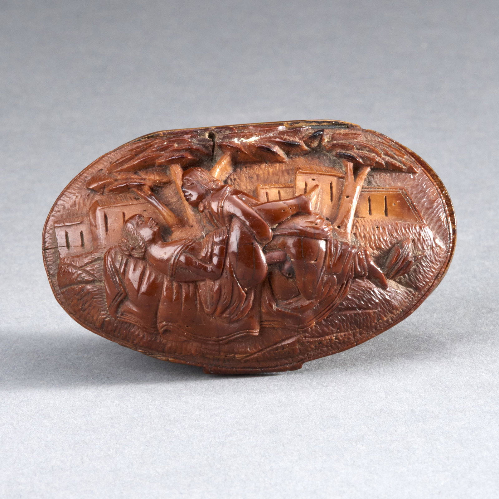 Erotic Carved Snuff Box: Rare, likely sailor-made antique erotic carved coquilla nut snuff box, ca. 18th century. Depicting an amorous couple in high-relief on an elaborate bed. MEASUREMENTS Length: 3 inches / 7 1/2 cm SHIPPI