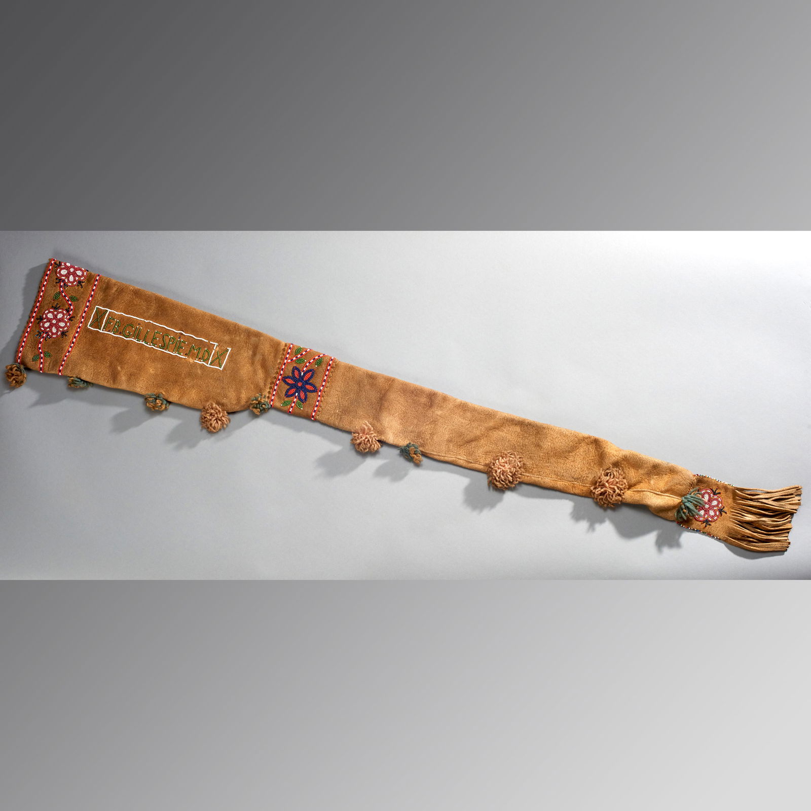 Rare & Fine Native American Rifle Case: Subarctic Cree or Athapaskan, ca. late 19th - early 20th century. Finely beaded leather rifle case inscribed with owner's name, F.B. Gillespie, MD an Alaskan physician who helped treat and vaccinate m