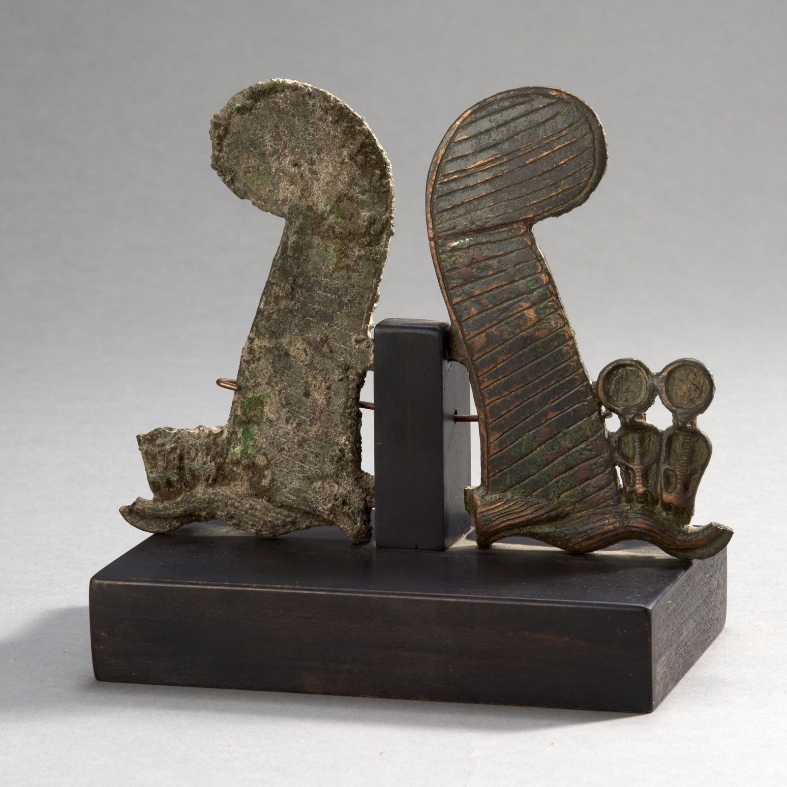 Ancient Egyptian Bronze Uraeus: Egypt, ca. Late Period. From the crown of a large bronze or wood figure. Custom mount. MEASUREMENTS Height without base: 4 inches / 10 cm SHIPPING $30 flat-rate shipping in the continental U.S. (insur