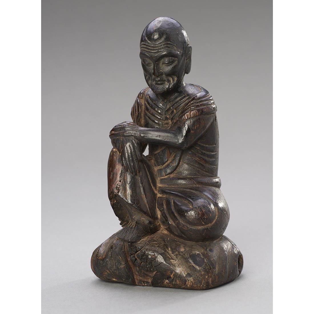 Chinese Wood Figure of Buddha: China, ca. 19th century or earlier. The emaciated figure seated in typical pose on rocky ground. MEASUREMENTS Height: 5 1/2 inches / 14 cm SHIPPING $20 flat-rate shipping in the continental U.S. (insu