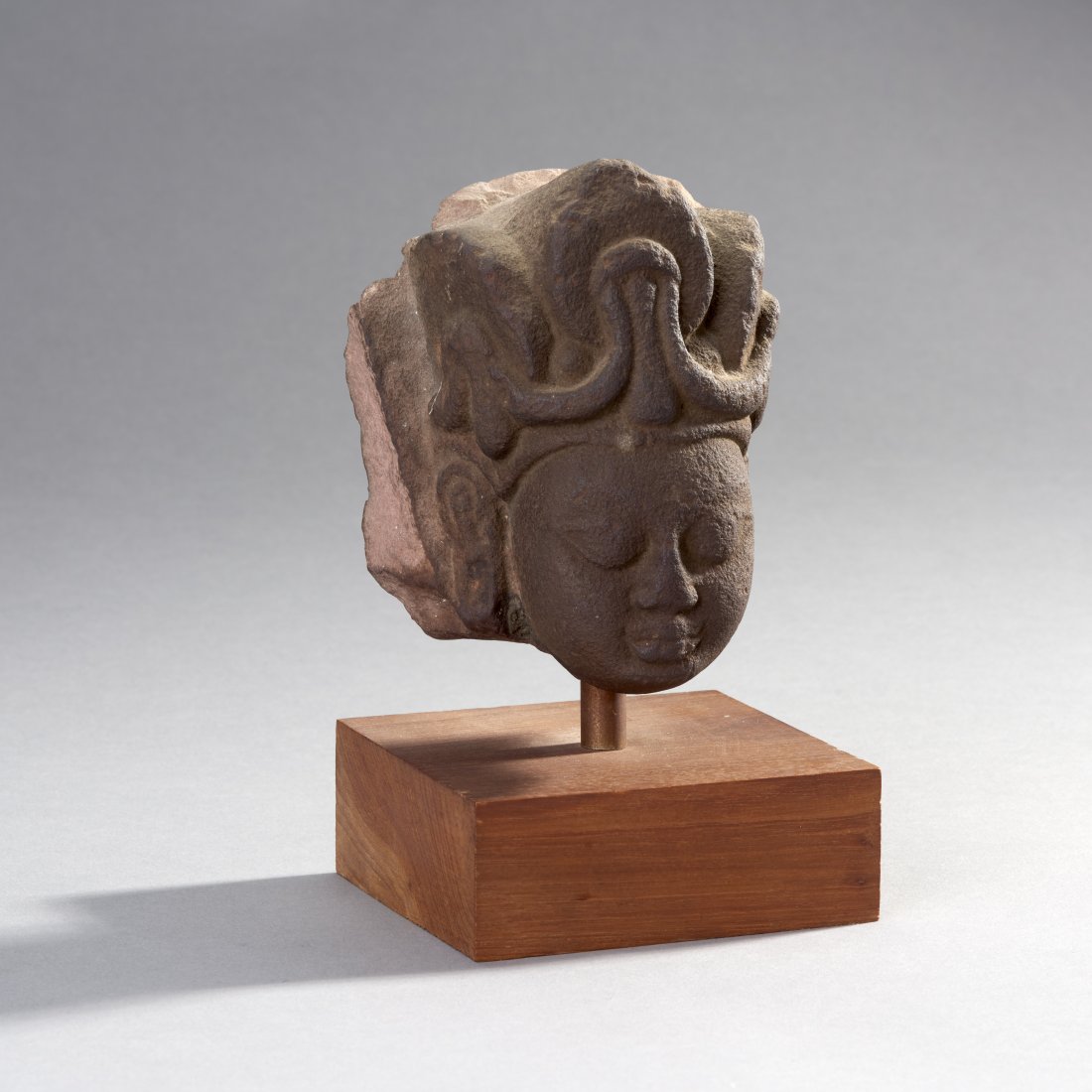 Kushan Stone Head of Bodhisattva: North India, ca. 3rd century AD. Kushan stone head of Bodhisattva. Custom base. Provenance: Ex Nick Douglas, NY. Sold at Doyle Galleries, NYC March 19, 1997. Height with base: 7.8 inches