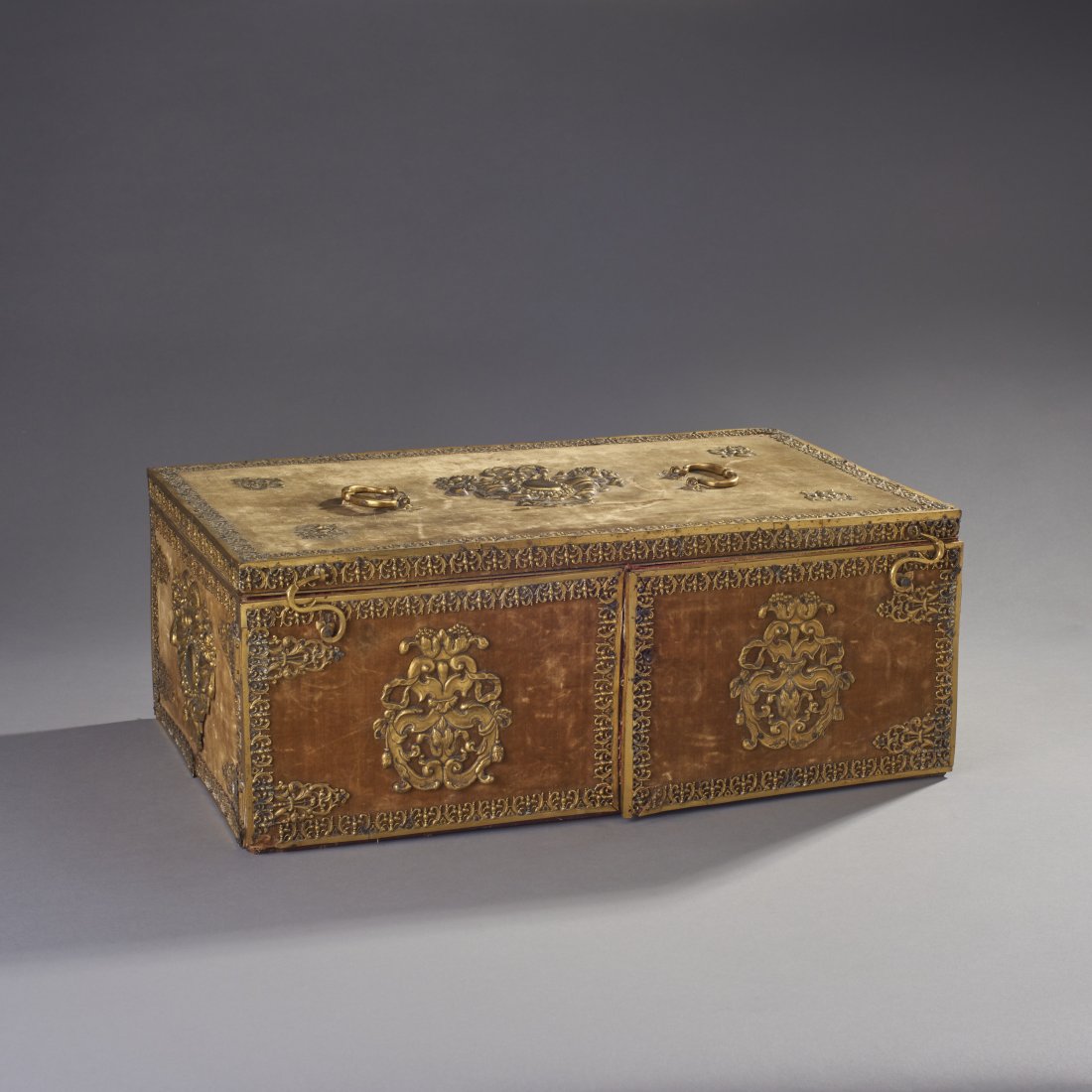 Fine Early French Toilette Casket: France, ca. 18th century. Fine and large early sample box. Surface covered in gold velvet and ormolu mounts, the front doors opening to five drawers, the top lid revealing various compartments. Proven
