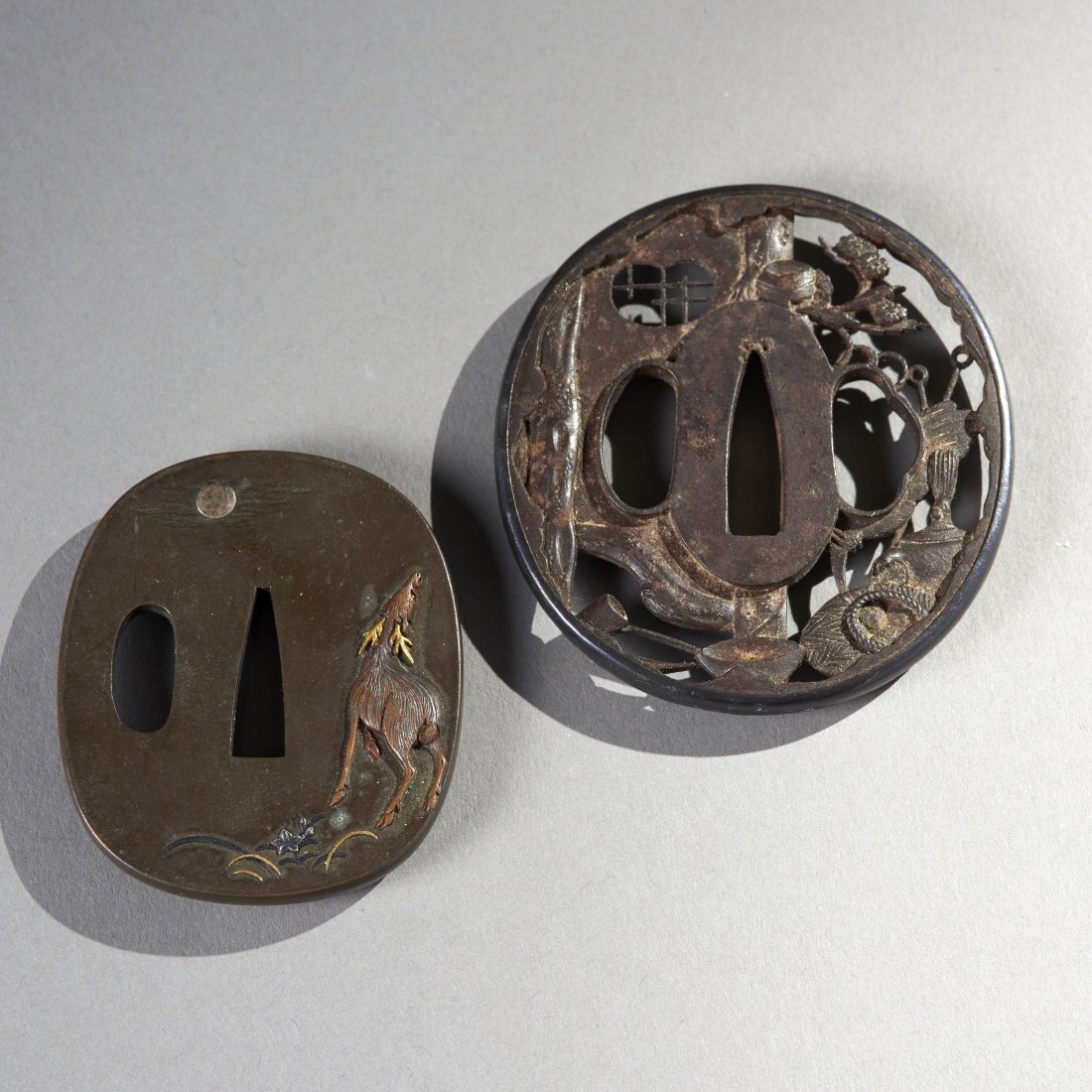 Two Edo Period Tsuba: Japan, Edo Period, ca. 18th-19th century. Two, very nice Tsuba examples, the smaller with gold and silver inlay. Provenance: Old Connecticut estate. Height of largest: 2.9 inches / 7.4 cm