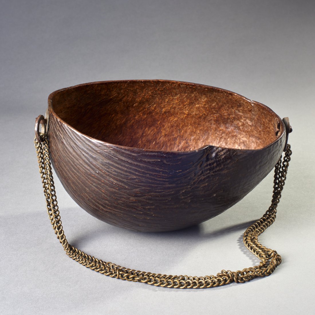 Indo Persian Kashkul: Central Asia, ca. 18th-19th century. Indo-Persian Kashkul, classic begging bowl used by dervish and other holy men. Carved from one half of a coco de mer shell. Length: 10 inches / 25.4 cm