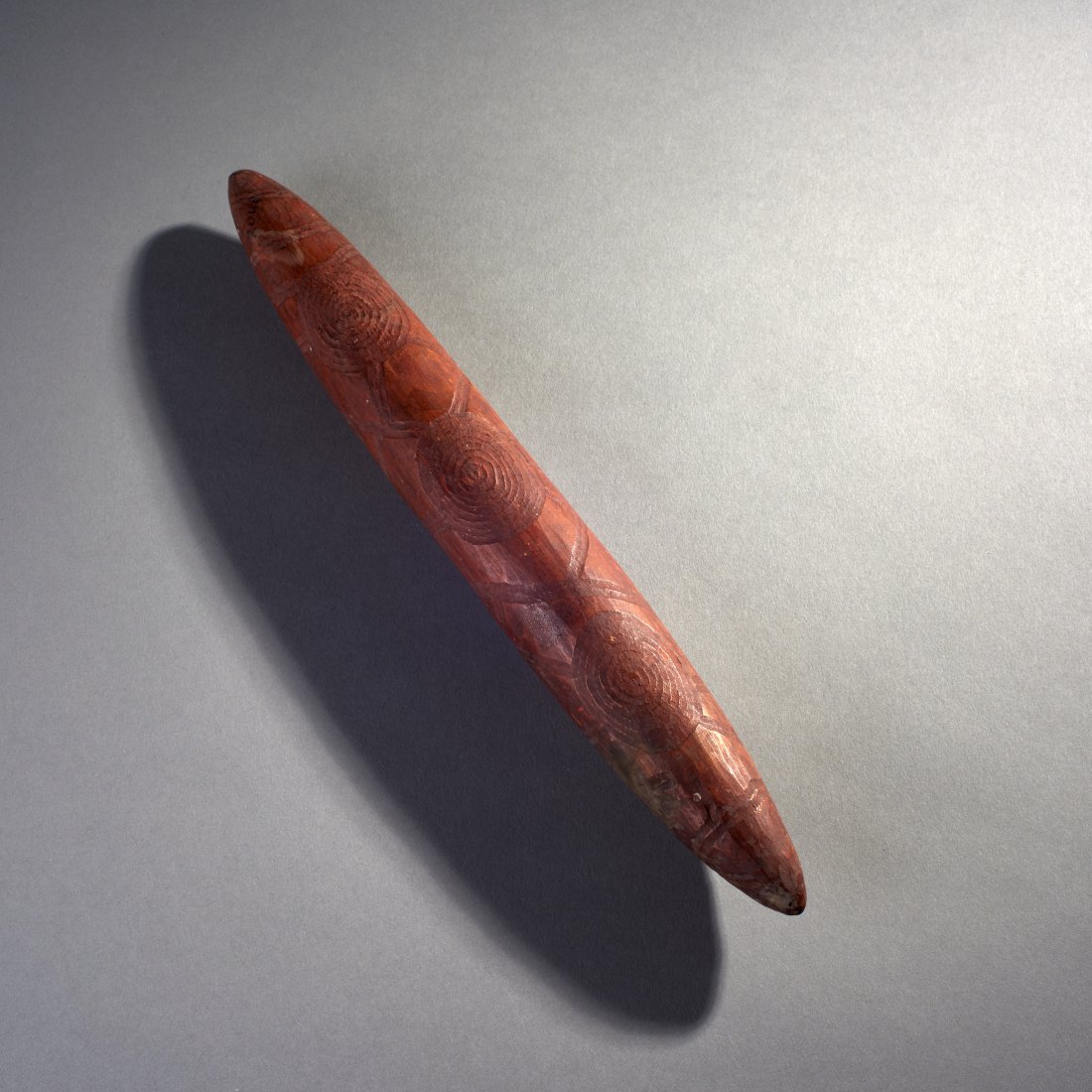 Wooden Churinga: Australia, ca. 19th-early 20th century. A wooden Churinga or Tjurunga from Central Australia, of rare 'cigar' form. With old collection number 2048. Provenance: Old Connecticut estate. Length: 12.8 in