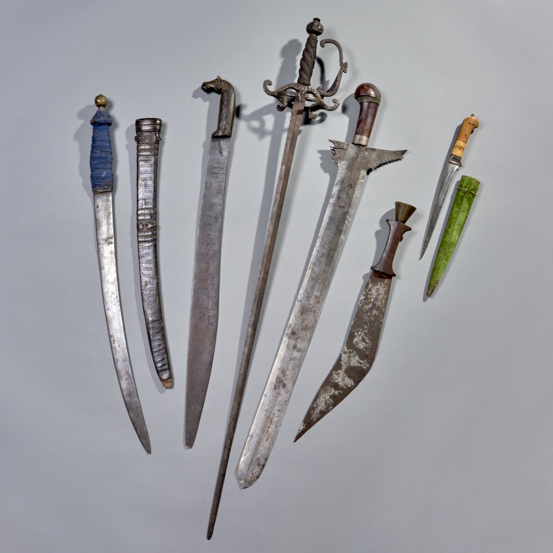 Six Swords: A French rapier, a Mexican revolution sword, a Moro kris, two North African swords and an Indo-Persian kard. Longest: 39 inches / 99 cm