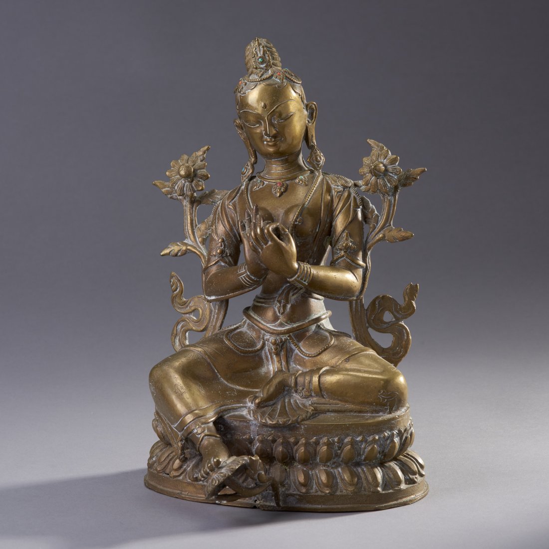 Large Nepalese Bronze Tara: Nepal, ca. 19th century. Large bronze Tara with "jewel" inlays. Height: 11.5 inches / 29.2 cm. Provenance: Ex: Henry Endicott Stebbins ( 1905-1973) collection. Mr. Stebbins was the first U.S. Ambassad