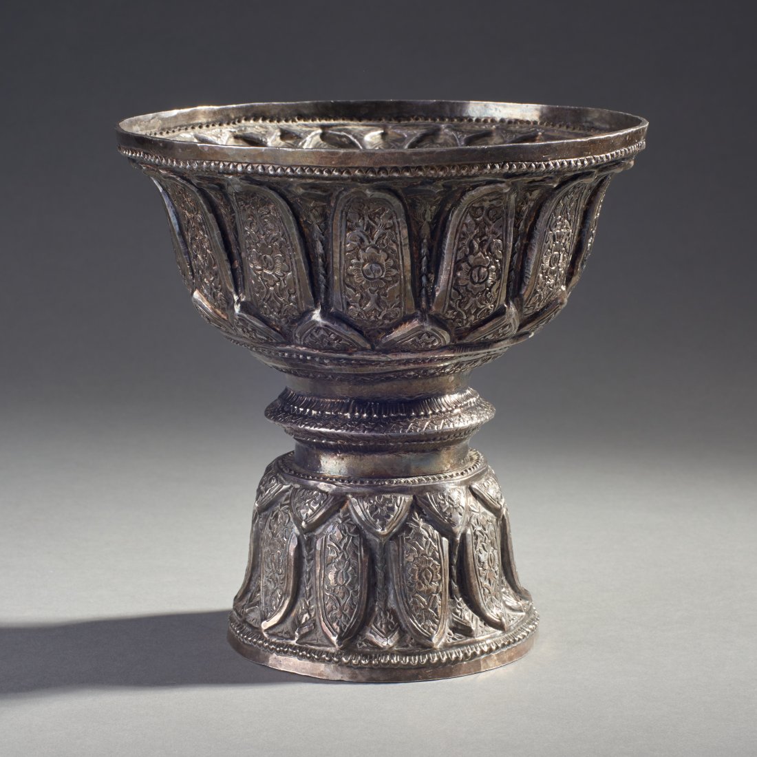 Large Thai Silver Pedestal Bowl: Thailand, ca. first half 20th century. Large silver Buddhist offering bowl. Height: 7.5 inches / 19.1 cm