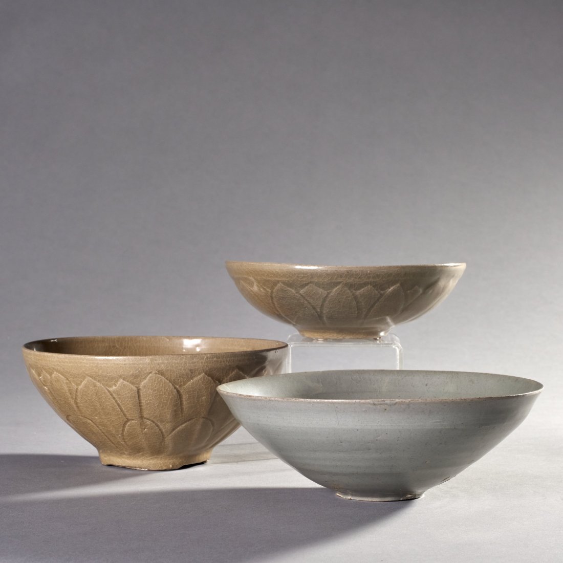 Group Of 3 Chinese Celadon Bowls: Group of 3 Chinese celadon bowls, 1 shallow and 1 deep light brown bowl with incised lotus leaf design. Provenance: Ex. Political Science, Ruggles Professor Emeritus James Morley (1921-2020). Professo