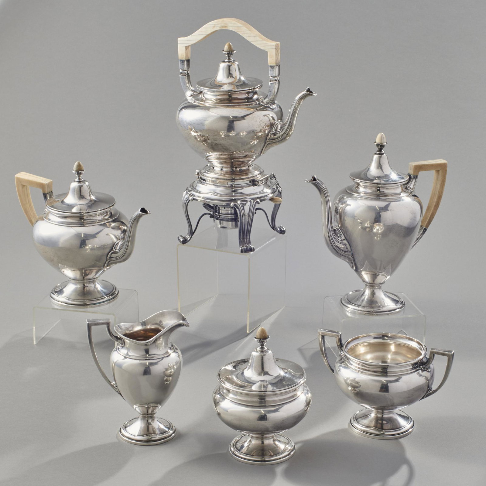 Gorham Sterling Silver 6 Piece Tea Set: Gorham sterling silver 6 piece tea set with bone or similar material handles and knobs/ finials, retailed by Brand-Chatillon, NY. Early 20th century. Set consists of a hot water pot with burner, coffe