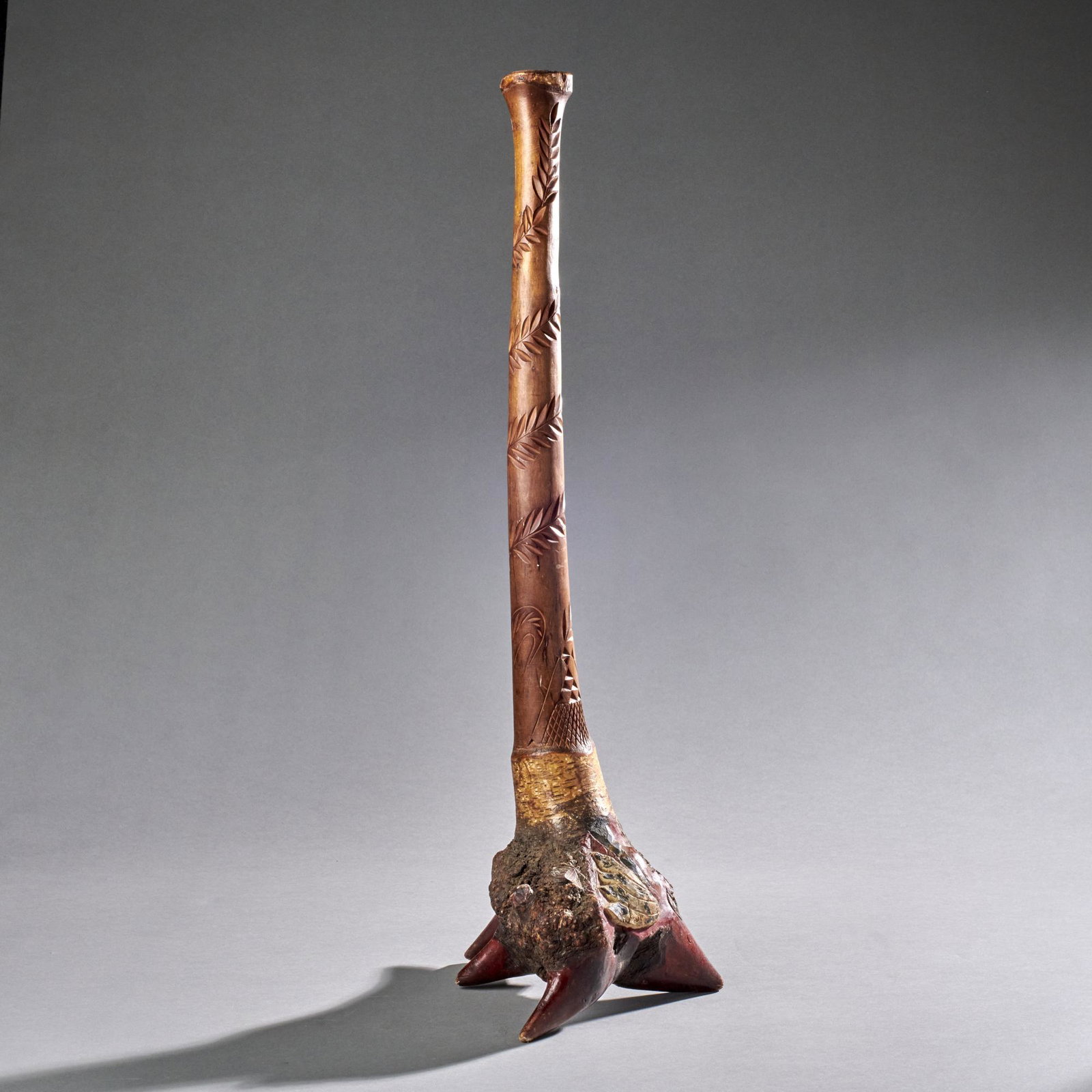 Carved Native American Birch Root Club: Carved Native American birch root club with chip carved handle and native American carved and enameled face profile, 20th century. Measures: 28 1/2" High x 10 1/2" Wide.