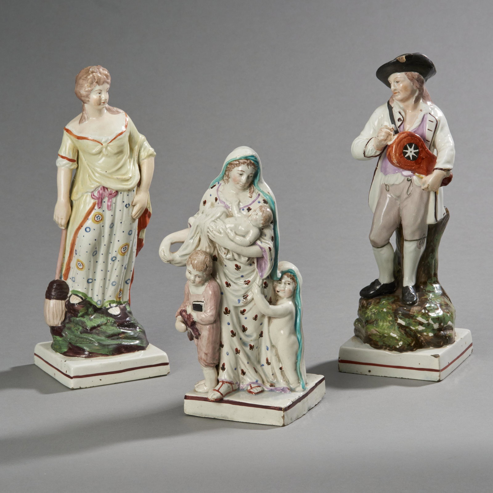 Lot Of 3 Staffordshire Pearlware Figures: Lot of 3 Staffordshire pearlware figures Including a pair of his and her figures, male with losses and 1 figure titled on base "Charity 1790". Measures: 9 1/2" High.