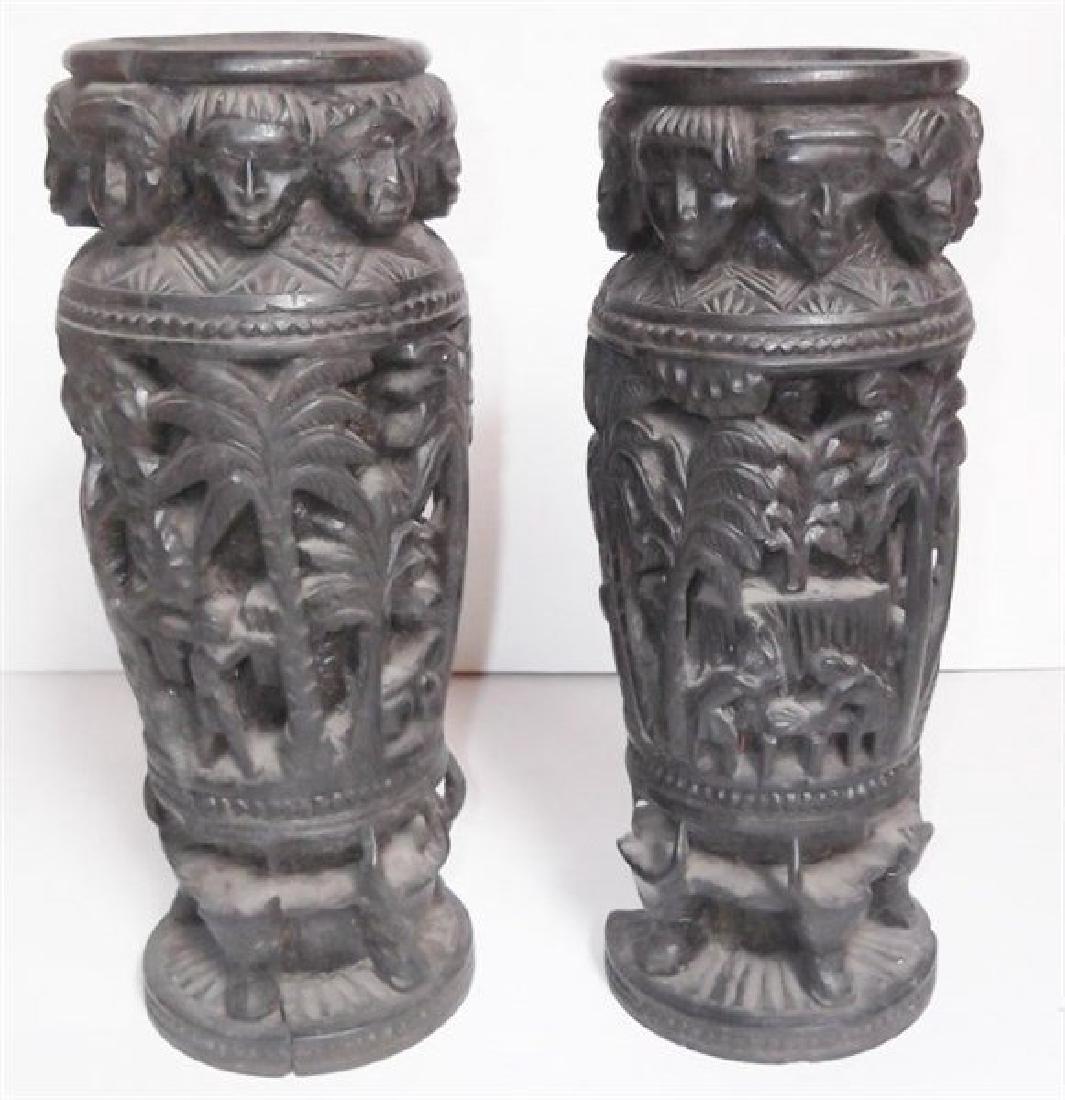 African Ebony statues: 2 Ebony family on man story pieces. 1 Repaired; Missing bottom piece. 11 1/2 inches high x 4 inches wide.