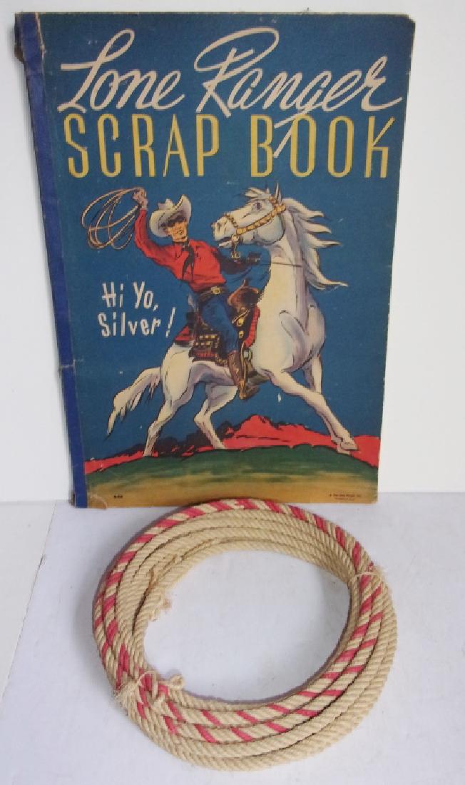 Lone Ranger scrapbook and rope: Lone Ranger scrapbook and rope. Scrapbook not used but has tears on cover and several pages. Largest measures 15.5" x 10.5".