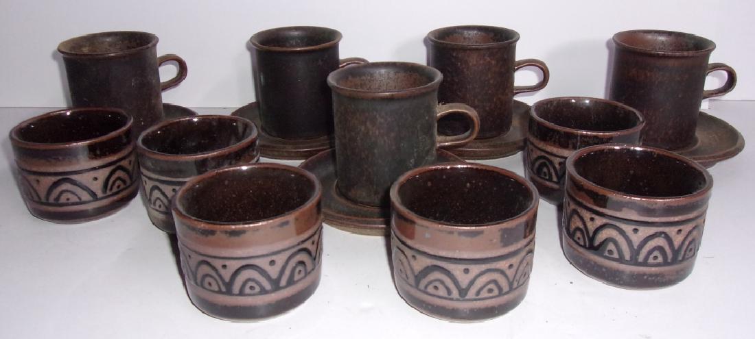 16 piece mid-century cups and saucers: 16 piece mid-century cups and saucers. Larger cups and saucers marked Arabia Finland. Largest measures 3 inches high.