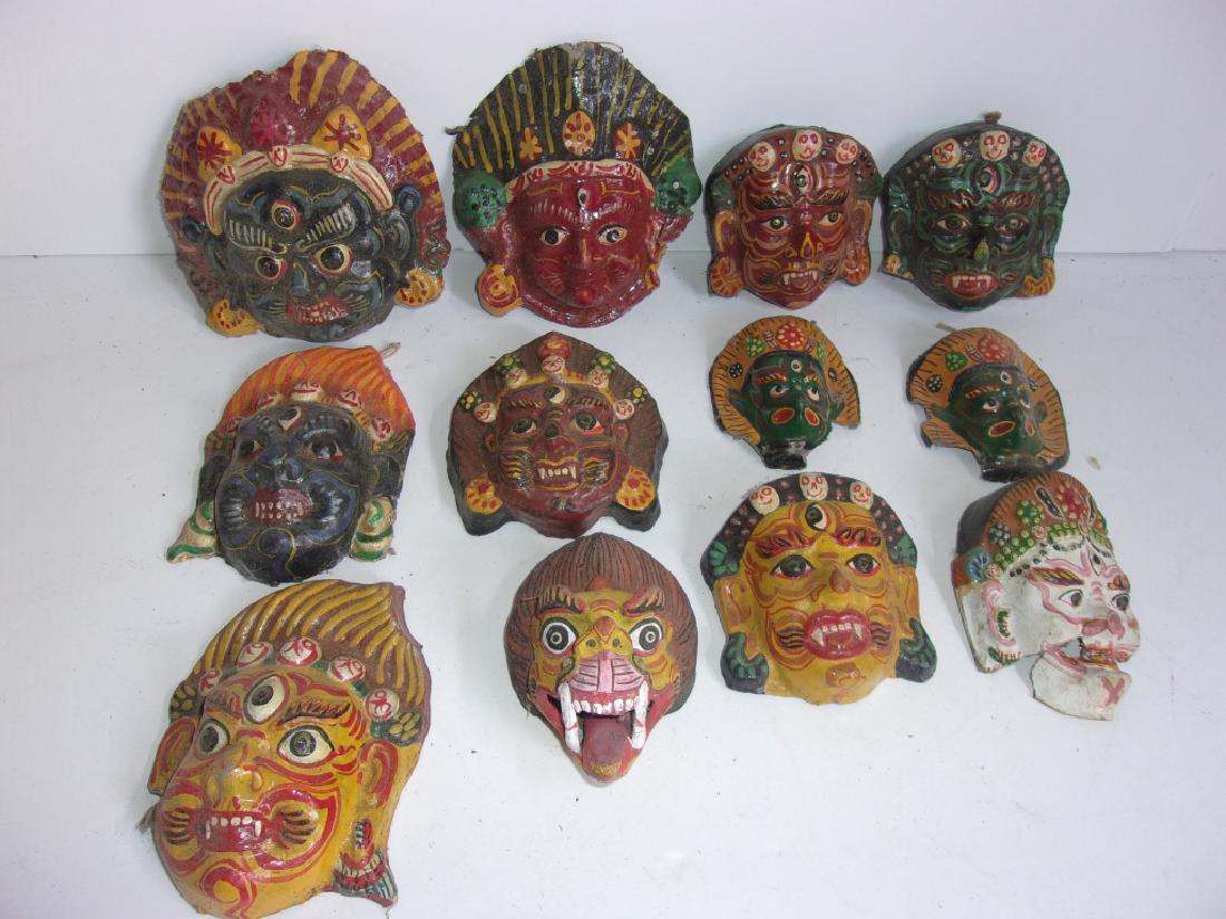 12 Indian papier-mache ceremonial masks (1 of 4)