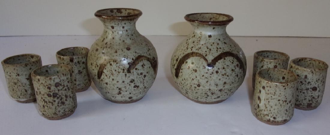 8 contemporary mid-century studio pottery: 8 contemporary mid-century American studio pottery pitchers & cups. Largest measures 10 inches x 4 inches.