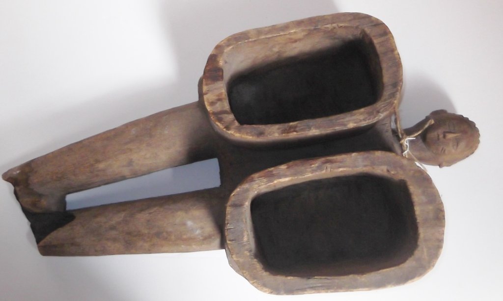 Ceremonial serving piece: Ceremonial serving piece, Central Africa probably Punu. Chipped; scratches. 24 inches x 13 1/2 inches wide x 5 1/2 inches deep.