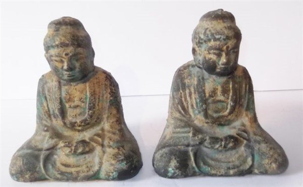 Pair of Buddha bookends: Pair of Buddha bookends, possibly made of plaster/stone 7 1/2 inches high.