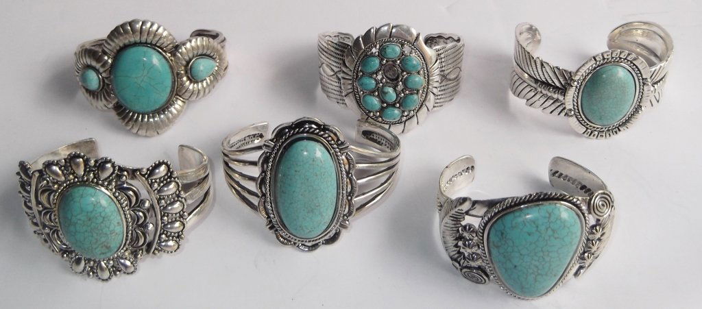 6 turquoise cuff bracelets: 6 turquoise cuff bracelets. marked 925 but are NOT 925 silver. 1 stone missing. 2 3/4 inches wide x 2 inches high.