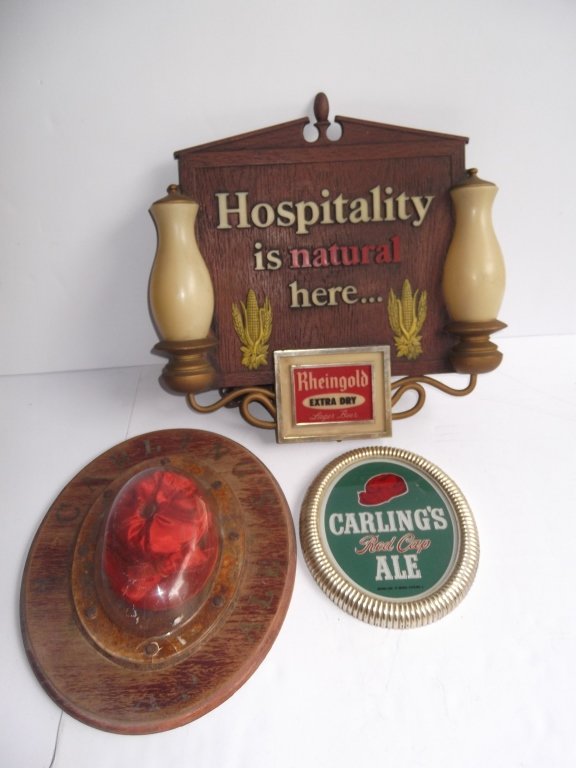 3 beer advertising display signs: 3 beer advertising display signs including Rheingold lighted sign; Carling's red cap wood plaque with red cap inside; Carling's red cap ale glass sign. Wear; faded. Largest measures 15 inches x 15 1/2