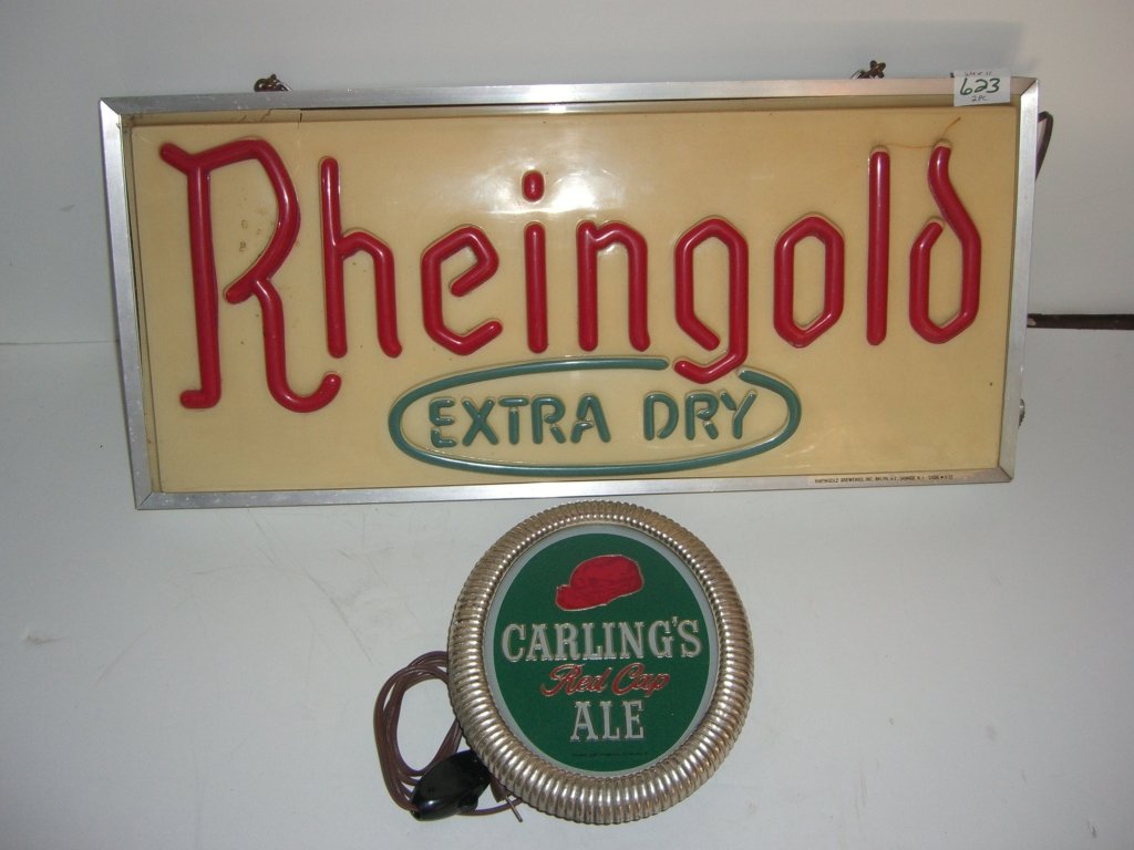 2 beer advertising lighted signs: 2 beer advertising lighted signs including Rheingold extra dry; Carling's Red Cap Ale. Working condition. Cracks in plastic; stains. Largest measures 24 inches x 11 inches.