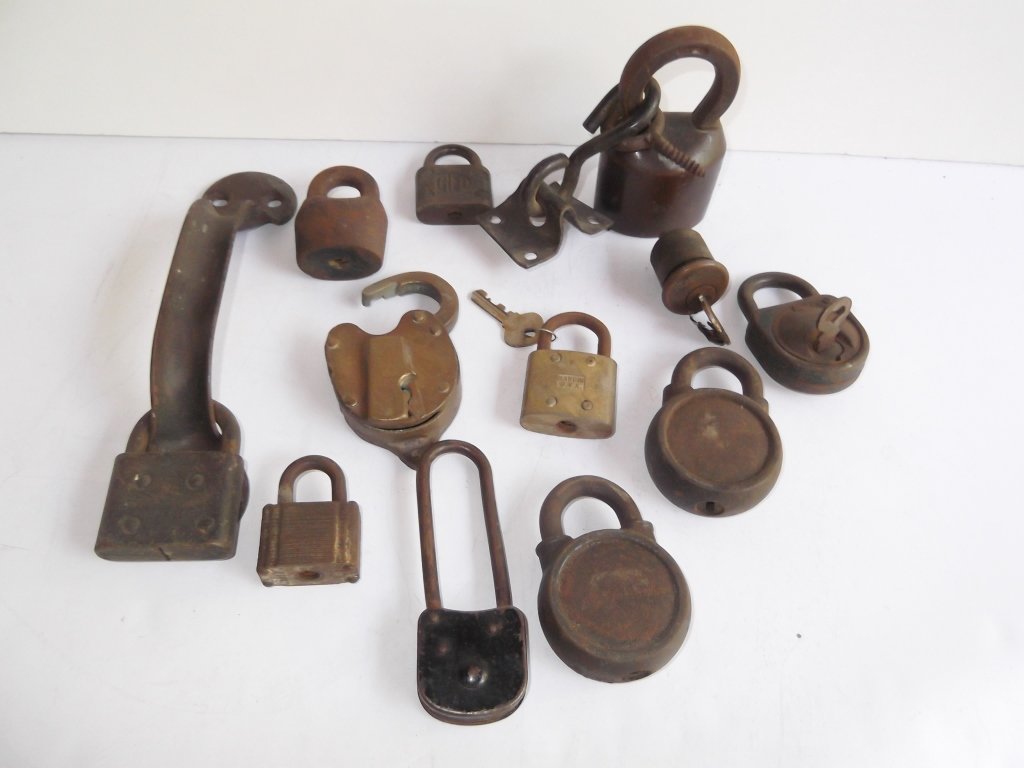 Collection of 12 assorted locks: Collection of 12 assorted locks including 1 lock with door handle. Not all have keys; some locked; used condition.