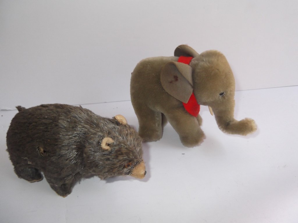 2 piece toy lot: 2 piece toy lot including 1970's Steiff elephant (lacking tag); & wind up 1960's bear made in Japan by Modern Toys (lacking key). Stains; used condition. Bear measures 4 inches x 4 1/2 inches; elephan