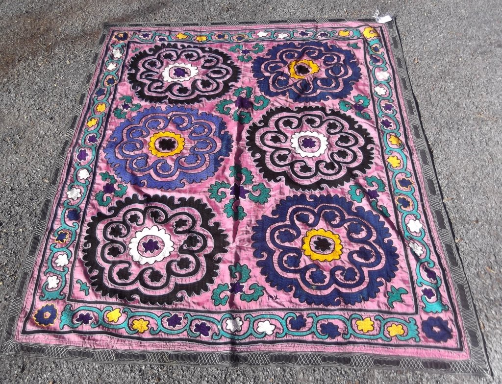 Vintage Suzani Central Asia Embroidery: Vintage Suzani Central Asia Embroidery quilt/blanket with initial "M.X.". Stains. 57 inches x 50 inches.