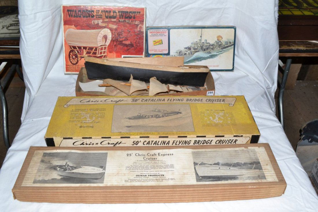 Models: two wooden Chris Craft cruisers, wooden sail: Models: two wooden Chris Craft cruisers, wooden sail boat and covered wagon, Lindberg plastic naval ship
