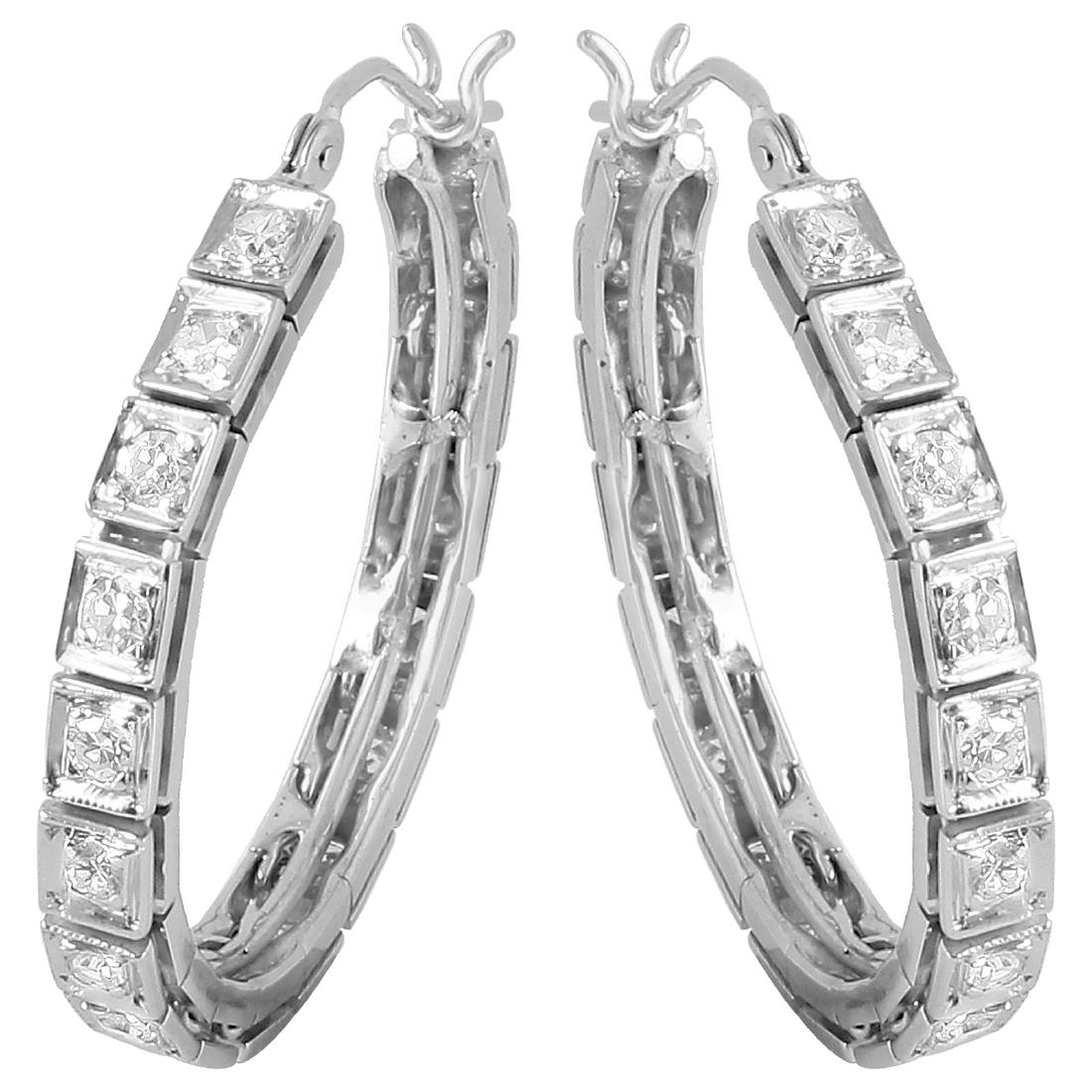 14KT White Gold Diamond Hoop Earrings: Round single cut diamonds are prong set from end to end on these brightly polished 14KT white gold hoop earrings. The curved post click tops snap shut, so the hoop will lay properly when worn. Specifi