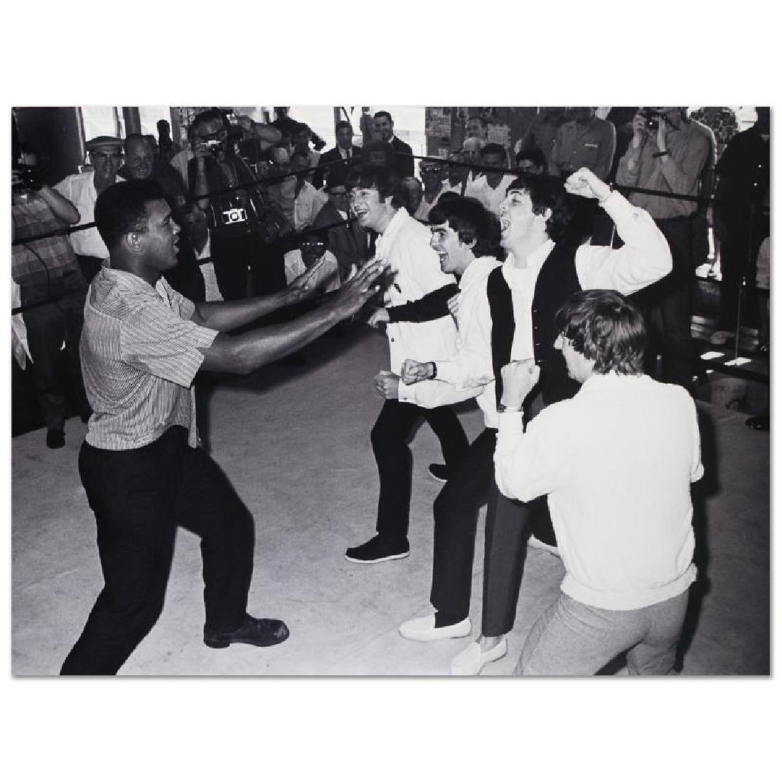 Muhammad Ali! Licensed Photograph of the Heavyweight: Own a piece of sports history with this Muhammad Ali and Beatles photo. Taken at the peak of his success as one of the greatest heavyweight championship boxers of all time, this photo is sure to compl