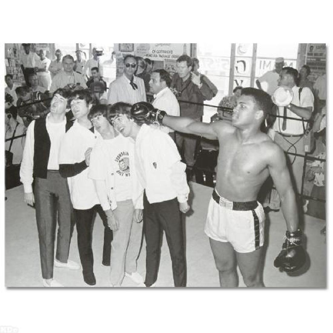 Muhammad Ali! Licensed Photograph of the Heavyweight: Own a piece of sports history with this Muhammad Ali and Beatles photo. Taken at the peak of his success as one of the greatest heavyweight championship boxers of all time, this photo is sure to compl